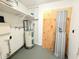 Utility room showing the water heater, pipes, and some building supplies at 3035 Pershing Ave, Sarasota, FL 34234