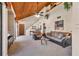 Open living room featuring a vaulted wood ceiling, carpet flooring, and plenty of natural light at 3073 Willow Grn # 36, Sarasota, FL 34235