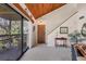 Bright living room with vaulted ceilings, balcony access, and a cozy atmosphere at 3073 Willow Grn # 36, Sarasota, FL 34235