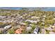 Scenic aerial shot of the charming neighborhood featuring lush greenery and distant water views at 3319 S Osprey Ave, Sarasota, FL 34239