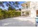 Spacious backyard with patio dining area and lush tropical landscaping at 3319 S Osprey Ave, Sarasota, FL 34239