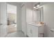 Modern bathroom with white vanity, stone countertops, and stylish fixtures at 3319 S Osprey Ave, Sarasota, FL 34239