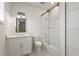 Bright bathroom with shower/tub combination with frameless sliding doors, and a modern vanity at 3319 S Osprey Ave, Sarasota, FL 34239