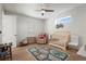 Stylish Bedroom features wood floors, crib, glider, and playful rug accenting the bright, airy space at 3319 S Osprey Ave, Sarasota, FL 34239