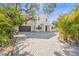 Beautiful two-story home with lush landscaping and a paver driveway at 3319 S Osprey Ave, Sarasota, FL 34239