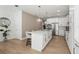 Spacious kitchen featuring a large island with seating and stainless appliances at 3319 S Osprey Ave, Sarasota, FL 34239