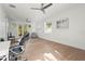Bright office space with desk, hardwood floors and french door access to a balcony at 3319 S Osprey Ave, Sarasota, FL 34239