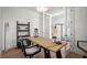 Bright home office with a wooden desk, modern chair, and stylish decor elements at 3319 S Osprey Ave, Sarasota, FL 34239