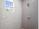 Detailed shower area showcasing marble walls, mosaic tile accents, and modern fixtures at 3319 S Osprey Ave, Sarasota, FL 34239