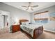 Bedroom featuring a ceiling fan, neutral paint, and a large window that lets in plenty of natural light at 360 Capri Isles Ct, Punta Gorda, FL 33950