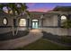 Elegant home entrance with double doors, manicured landscaping, and attractive architectural details at 360 Capri Isles Ct, Punta Gorda, FL 33950