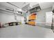 Spacious garage with epoxy flooring, built-in cabinets, and ample storage space at 360 Capri Isles Ct, Punta Gorda, FL 33950