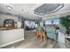 Bright and airy living room featuring stylish decor, hardwood floors, and access to the outdoor living space at 360 Capri Isles Ct, Punta Gorda, FL 33950