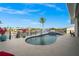 Backyard pool with a jacuzzi, great landscaping and a view of the water and neighborhood at 360 Capri Isles Ct, Punta Gorda, FL 33950