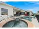 A stunning pool and spa area with clear blue water, perfect for relaxation and entertaining outdoors at 360 Capri Isles Ct, Punta Gorda, FL 33950