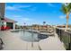 Backyard view with pool, spa, grill, outdoor seating, and waterfront access ideal for entertainment at 360 Capri Isles Ct, Punta Gorda, FL 33950