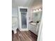 Bathroom featuring a tiled shower and framed mirror at 3987 Maceachen Blvd # 132, Sarasota, FL 34233