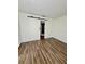 Bright bedroom with sliding barn door at 3987 Maceachen Blvd # 132, Sarasota, FL 34233