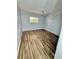 This bedroom has wood-look floors and a ceiling fan at 3987 Maceachen Blvd # 132, Sarasota, FL 34233