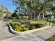 The entrance sign to Tregate East is surrounded by lush landscaping at 3987 Maceachen Blvd # 132, Sarasota, FL 34233