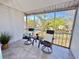 Relaxing screened-in patio with comfortable seating at 3987 Maceachen Blvd # 132, Sarasota, FL 34233