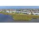 Aerial view of the waterfront condominium building surrounded by green spaces and landscaping at 4734 Independence Dr # 4734, Bradenton, FL 34210