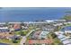 Scenic aerial view of condo community by the water, with tennis courts and swimming pool at 4734 Independence Dr # 4734, Bradenton, FL 34210