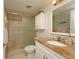 Bathroom features a granite countertop and glass shower door at 4734 Independence Dr # 4734, Bradenton, FL 34210