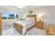 Comfortable bedroom featuring a large window with water views, light walls, and tiled flooring at 4734 Independence Dr # 4734, Bradenton, FL 34210