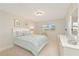 Cozy bedroom offers soft lighting and calming coastal hues at 4734 Independence Dr # 4734, Bradenton, FL 34210