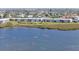 Waterfront condominiums offer scenic views with kayaks visible on the water at 4734 Independence Dr # 4734, Bradenton, FL 34210