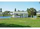 Scenic lake view with a white gazebo, fountain, and lush greenery along the shoreline at 4734 Independence Dr # 4734, Bradenton, FL 34210