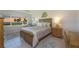 Serene main bedroom features a comfortable bed, soft lighting, and a picturesque water view from the window at 4734 Independence Dr # 4734, Bradenton, FL 34210