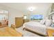 Bright main bedroom features an ocean view and coastal decor at 4734 Independence Dr # 4734, Bradenton, FL 34210