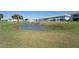 Condominium exterior with pond, fountain and lawn at 4734 Independence Dr # 4734, Bradenton, FL 34210