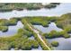 Captivating aerial view of the property showcasing the unique waterway access and natural beauty of the surrounding area at 4920 Kestral Park Cir # 11, Sarasota, FL 34231