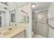 Bathroom featuring a sink, vanity, medicine cabinet, and walk-in shower at 4920 Kestral Park Cir # 11, Sarasota, FL 34231