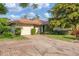 Charming home exterior with a brick driveway, a single-car garage, and well-maintained landscaping at 4920 Kestral Park Cir # 11, Sarasota, FL 34231