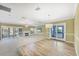 Bright living room featuring a fireplace, wood floors, and sliding door access to the outdoors at 4920 Kestral Park Cir # 11, Sarasota, FL 34231