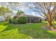 A lovely yard and enclosed porch create the ideal outdoor space for relaxation and enjoyment at 4920 Kestral Park Cir # 11, Sarasota, FL 34231
