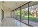 Bright and sunny sun room featuring tile floor and large sliding glass windows at 4920 Kestral Park Cir # 11, Sarasota, FL 34231