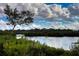 Picturesque water view showcases lush greenery and serene waterway perfect for kayaking and enjoying nature at 4920 Kestral Park Cir # 11, Sarasota, FL 34231