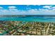 Beautiful aerial view capturing a waterfront community with vibrant waterways and lush landscaping at 526 Bird Key Dr, Sarasota, FL 34236