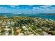Scenic aerial view of a waterfront community with canals and vibrant turquoise waters, near city skyline at 526 Bird Key Dr, Sarasota, FL 34236