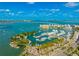 Expansive aerial view of the harbor featuring a boat marina and stunning waterfront cityscape at 526 Bird Key Dr, Sarasota, FL 34236