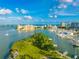 Breathtaking aerial view capturing the marina, waterfront buildings, and scenic water views at 526 Bird Key Dr, Sarasota, FL 34236