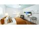 Bright bedroom featuring shuttered windows, wood floors and a stylish chair at 526 Bird Key Dr, Sarasota, FL 34236