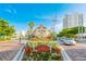 Burns Square's charming streetscape features historic architecture, lush landscaping, and walkable street at 526 Bird Key Dr, Sarasota, FL 34236