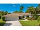 Charming single-story home boasting lush landscaping, a spacious two-car garage and an attractive tile roof at 526 Bird Key Dr, Sarasota, FL 34236