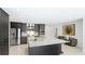Well-appointed kitchen featuring stainless steel appliances, a spacious island, and ample storage for culinary enthusiasts at 526 Bird Key Dr, Sarasota, FL 34236